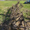 Soil leveling beam